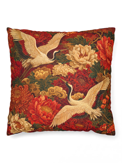A square decorative throw pillow featuring a classic Japanese-style tapestry print with red cranes, cream peonies, and red chrysanthemums on a dark background.