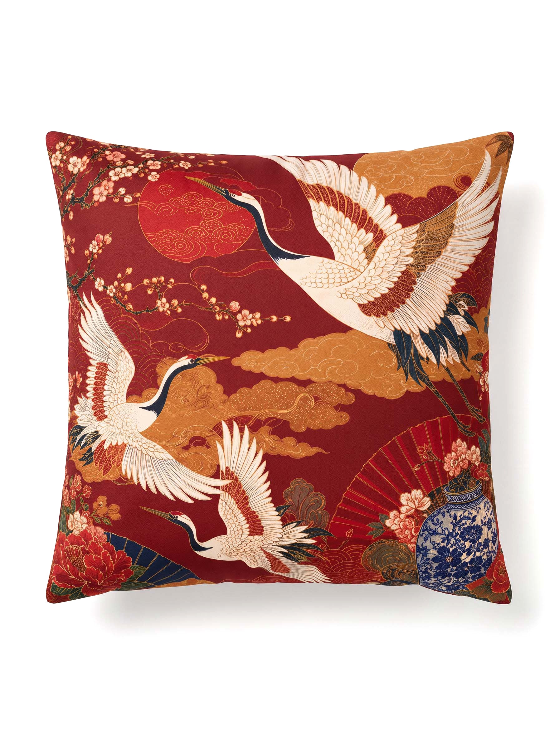 A square decorative throw pillow featuring a traditional Japanese-inspired print with white cranes, a red sun, clouds, and floral motifs on a deep red background.